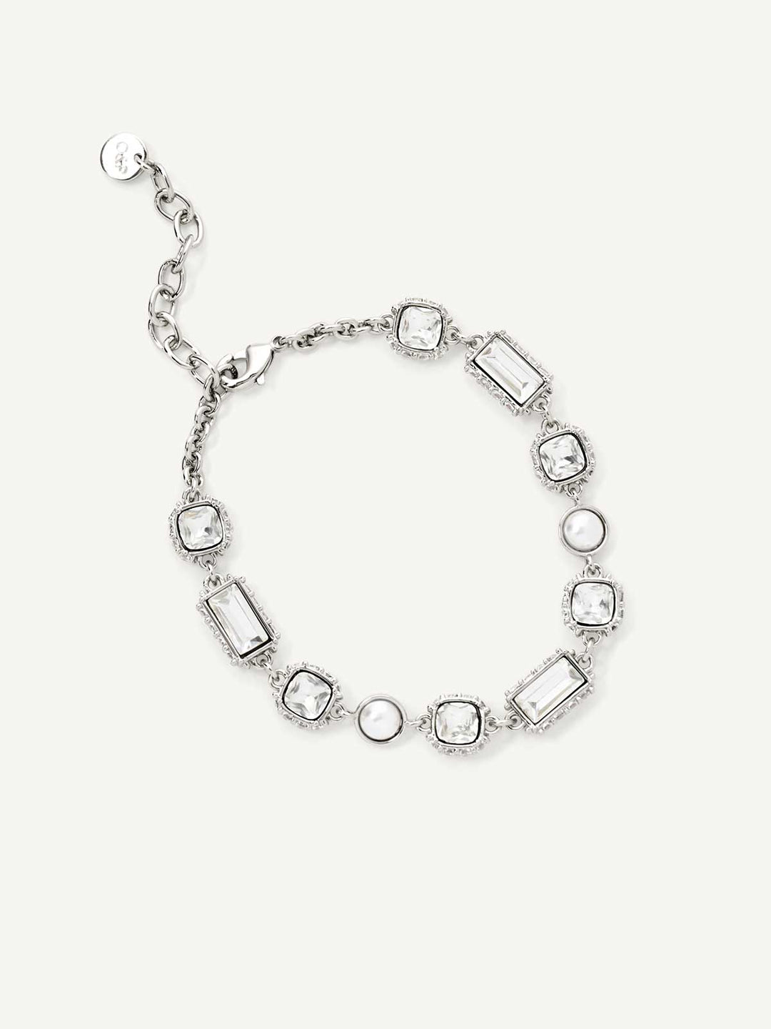 Silver bracelet with rectangular and round stones on a white background