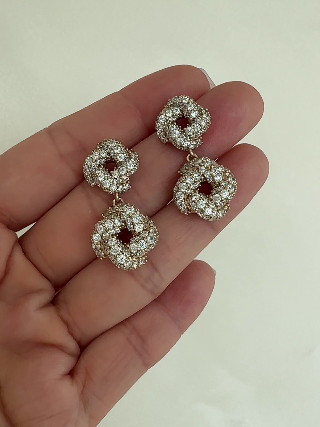 Pair of gold drop earrings with crystal-like stones